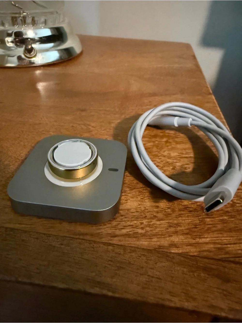 Oura Gold Smart Ring Charger Accent
